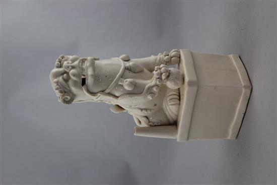 A Chinese Dehua blanc de chine Buddhist lion figural jos-stick holder, Kangxi period, 27.5cm